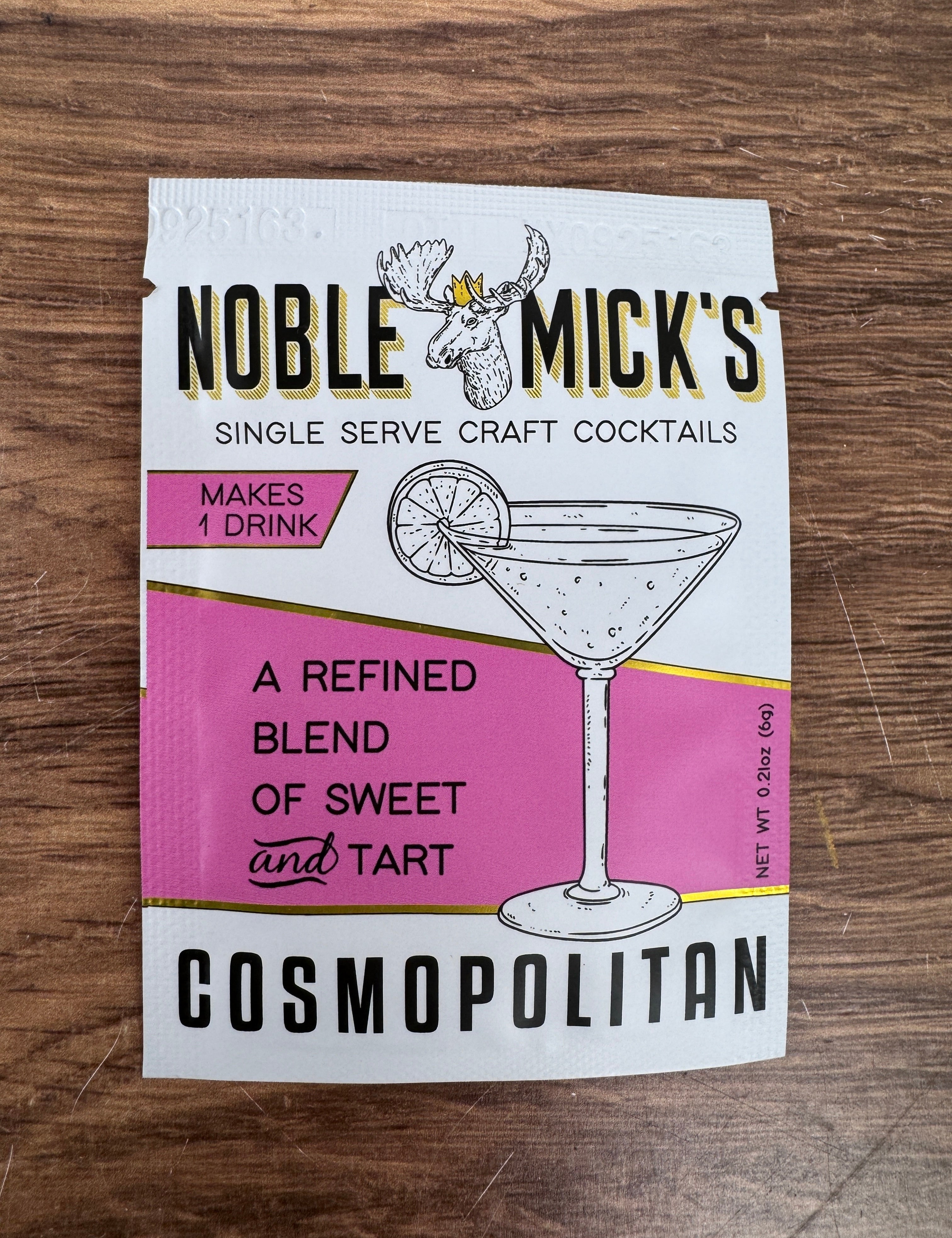 Single-serve Cosmopolitan craft cocktail mix packet by Noble Micks displayed at JSQ Mercantile – a women’s boutique and gift shop in La Grange, IL.