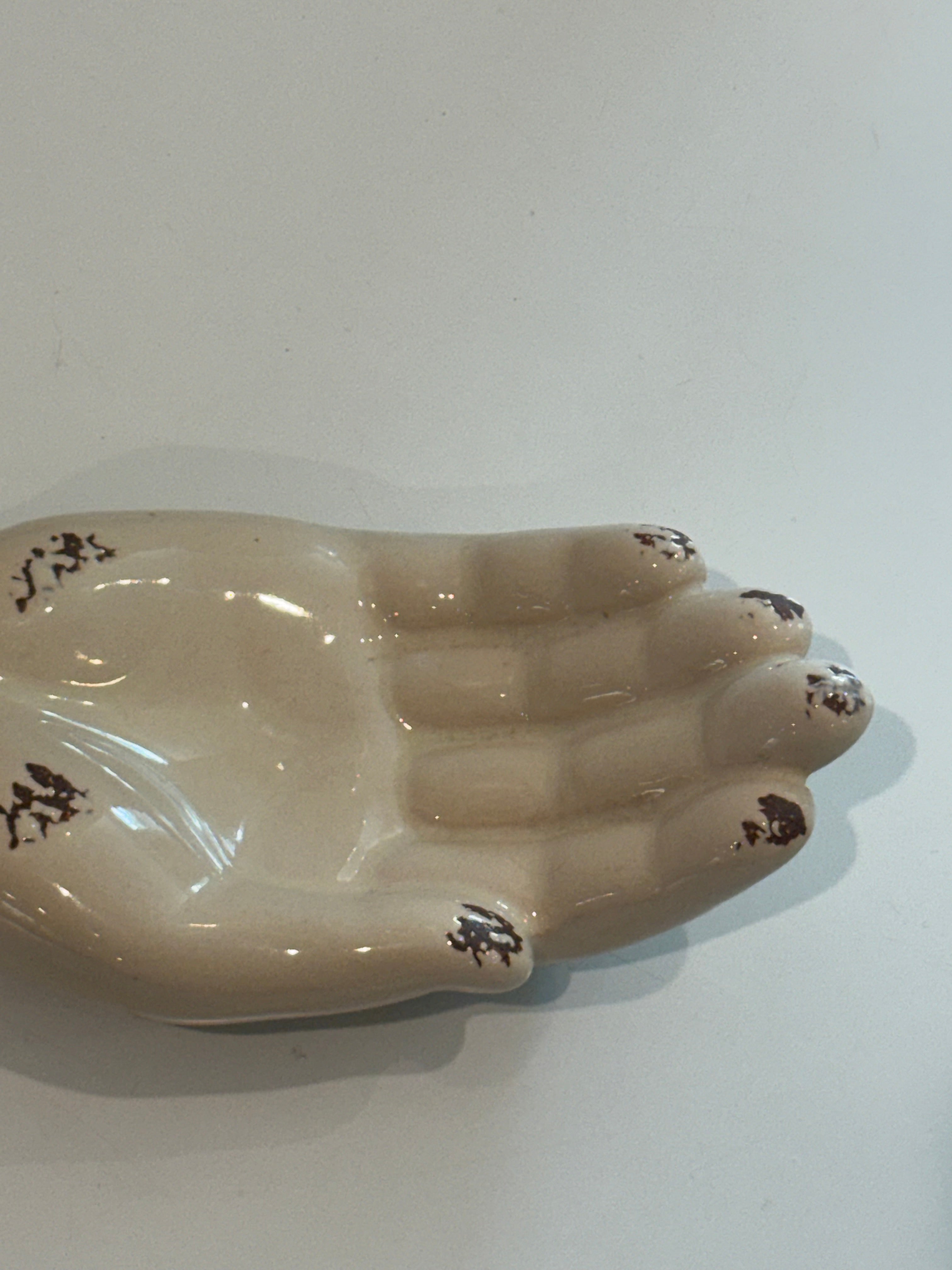 Hanging porcelain hand- wall pocket or tabletop decor.