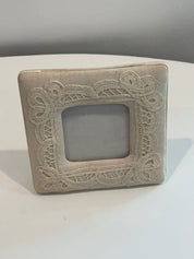 Fabric covered picture frame with lace detail