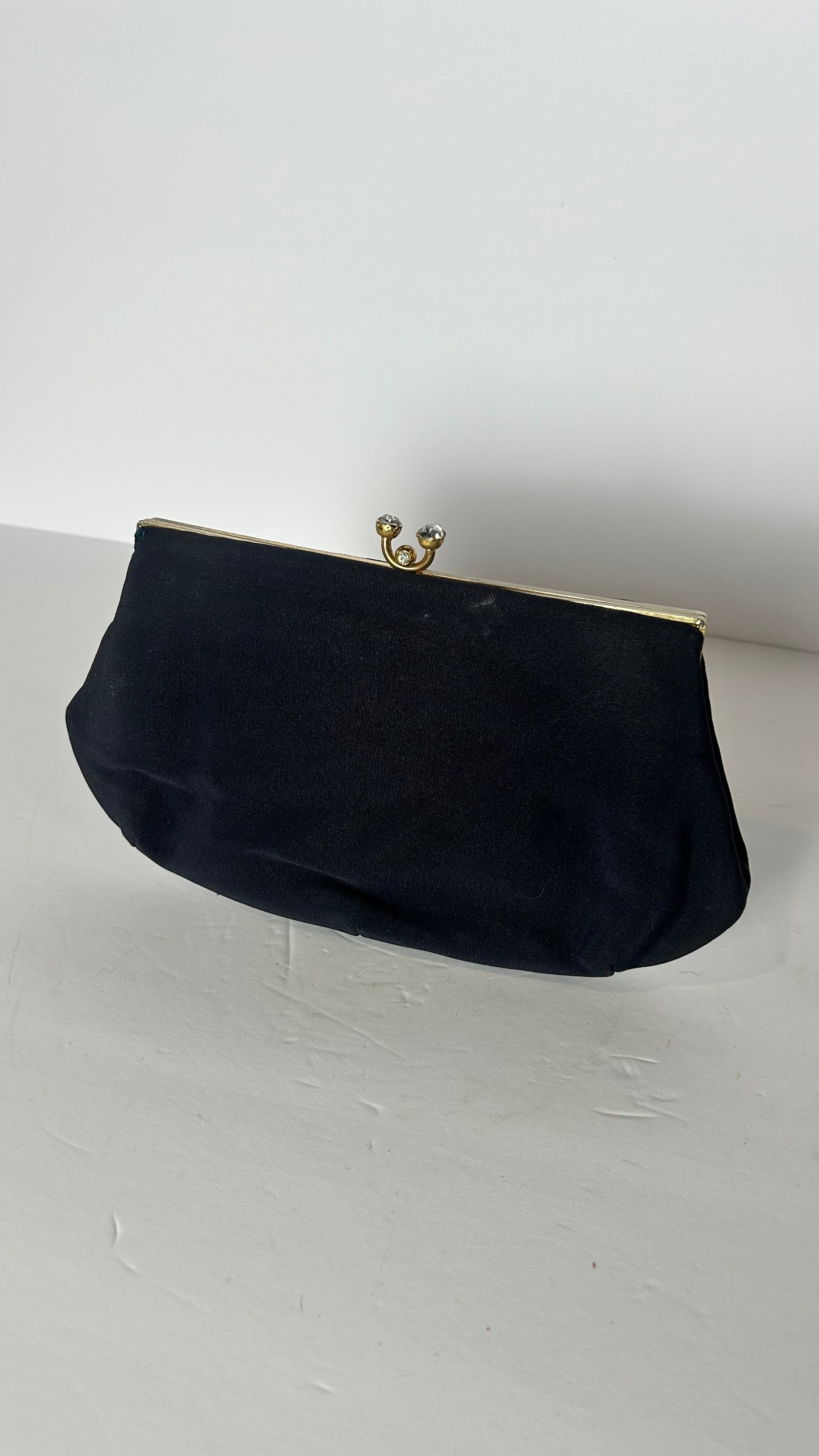 Vintage black lined clutch with kiss clasp