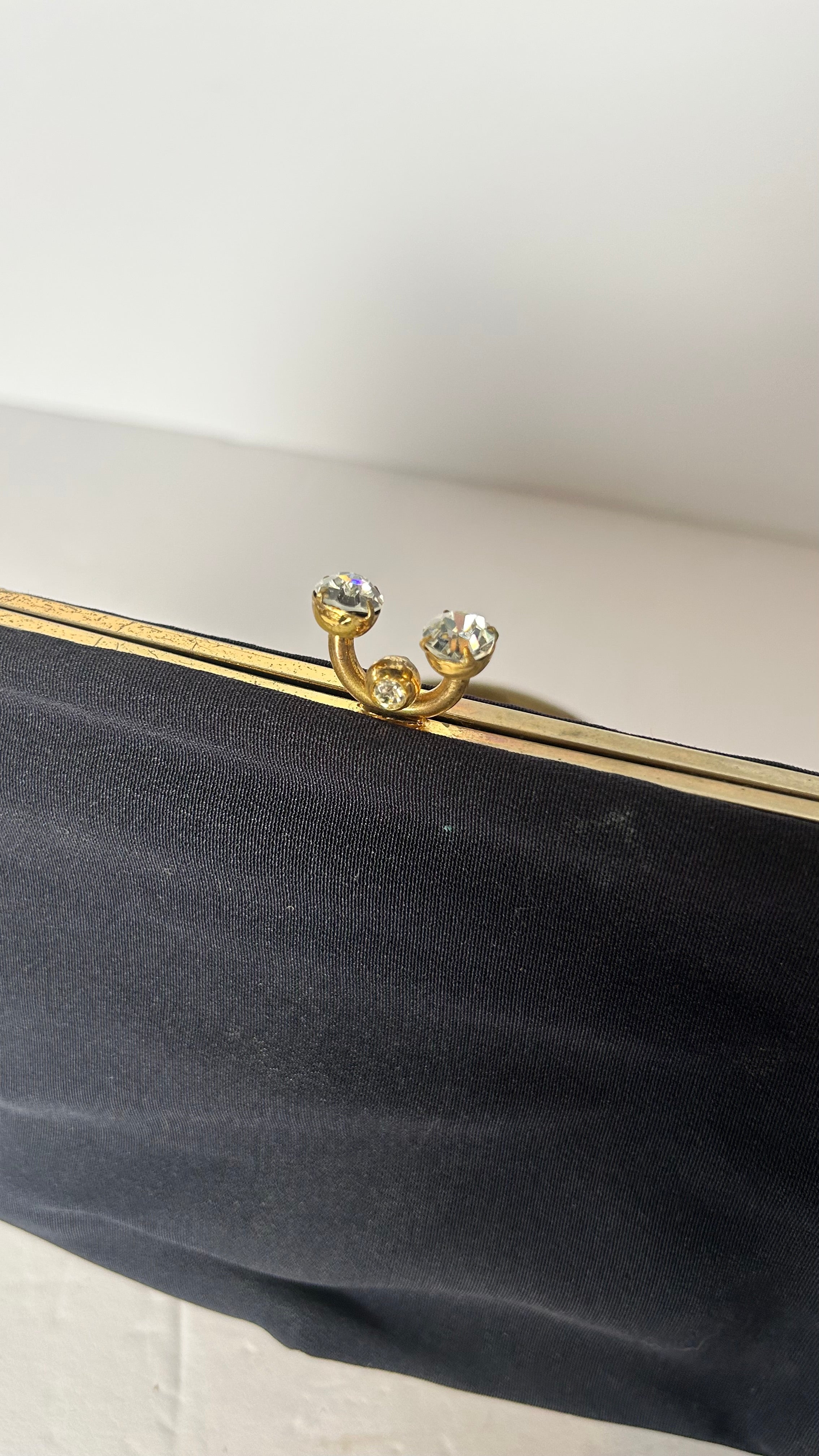Vintage black lined clutch with kiss clasp