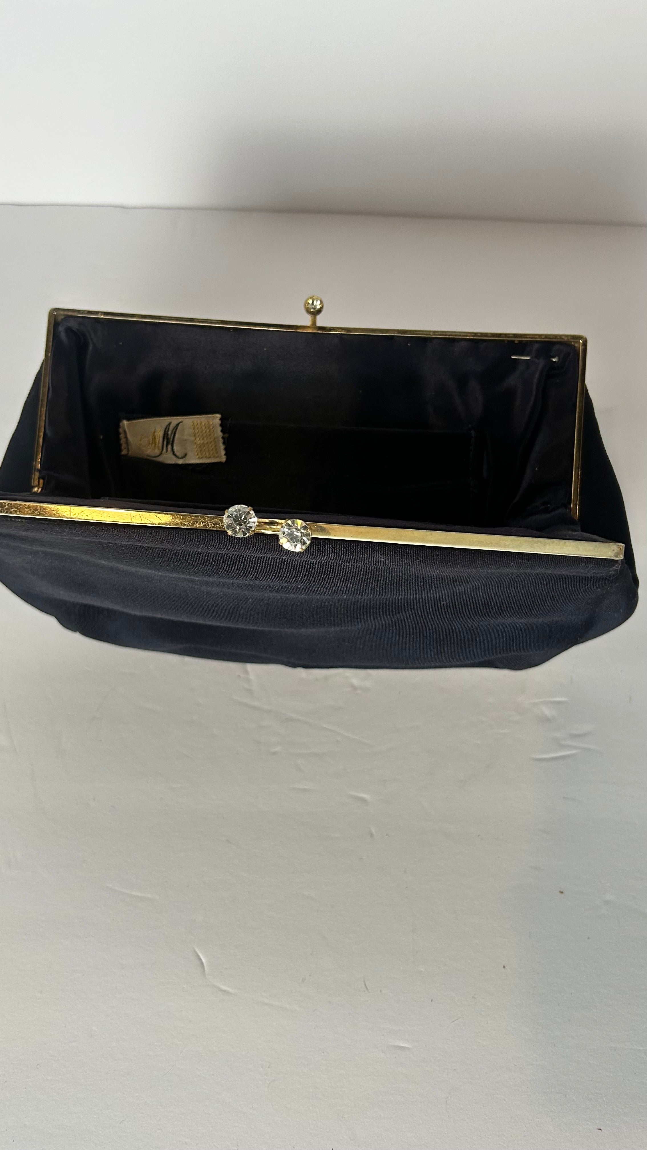 Vintage black lined clutch with kiss clasp