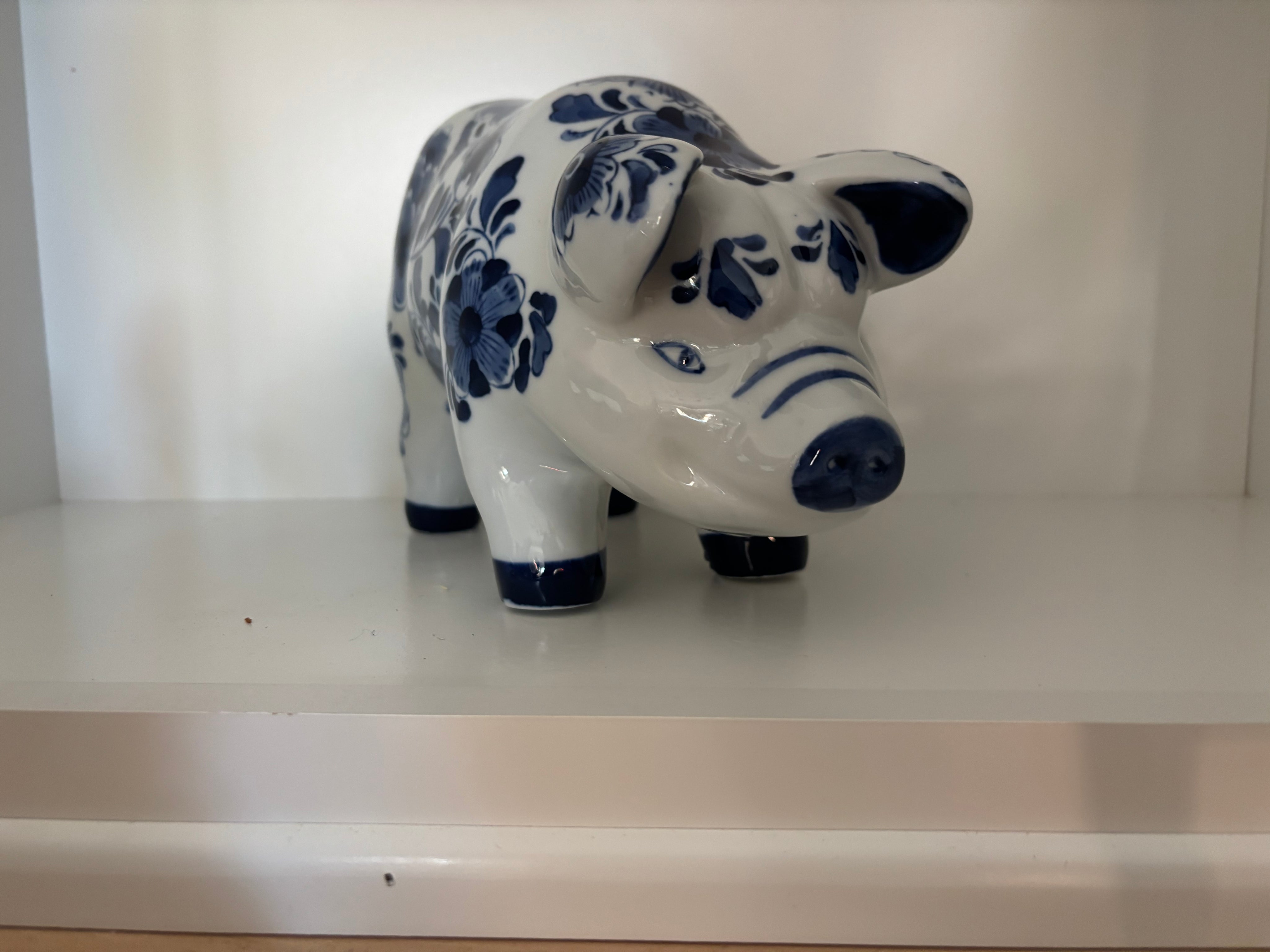blue and white floral ceramic pig