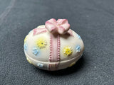 Sm. pink ribbon egg w/blue/yellow flowers