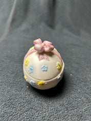 Sm. pink ribbon egg w/blue/yellow flowers