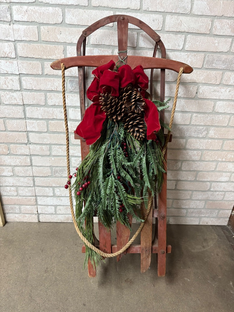 Old Red Sled with Christmas Greens Embellishment