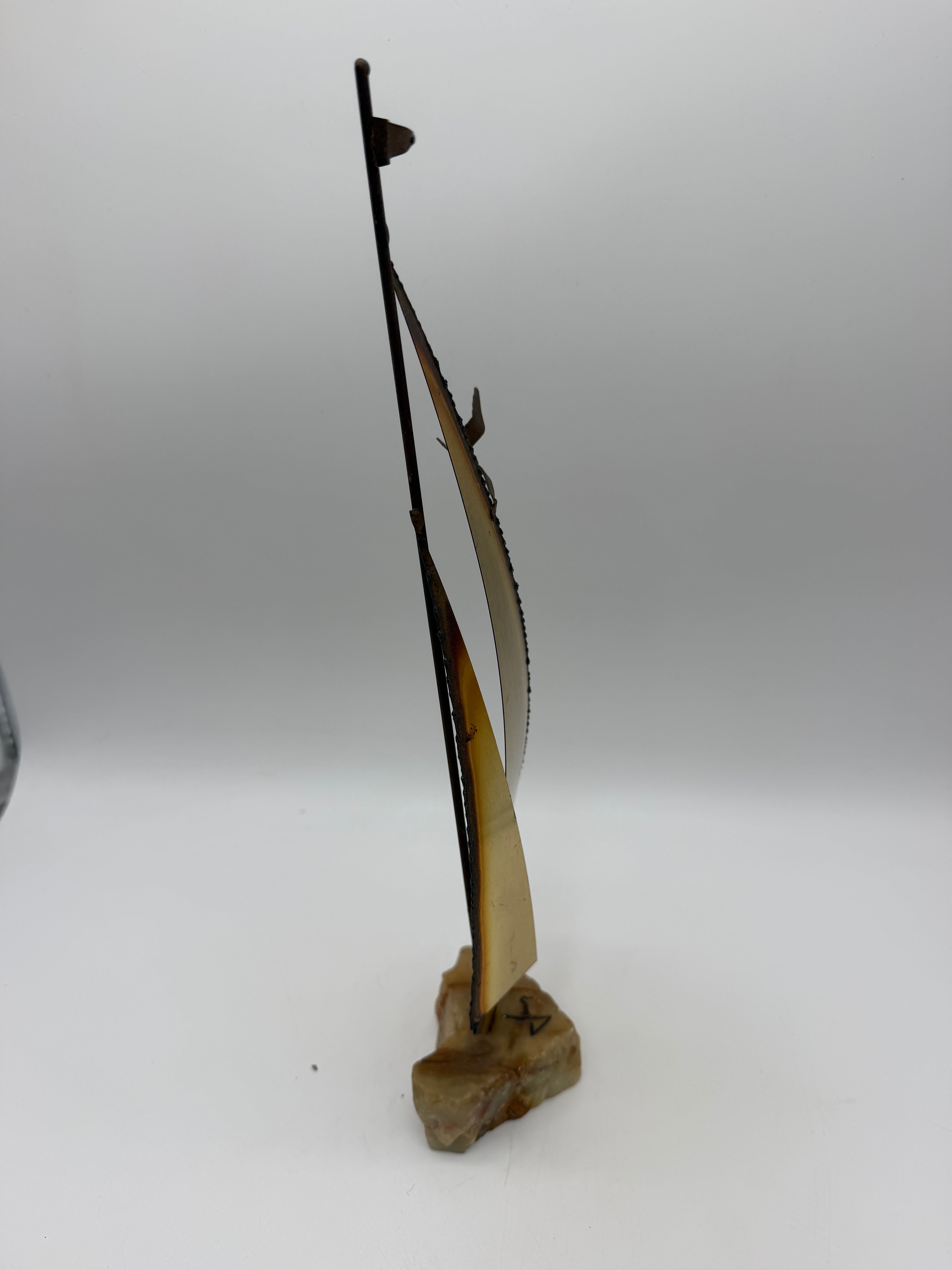 Vintage brutalist, brass and stone sailboat