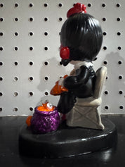 Not-So-Precious-Moments figurine