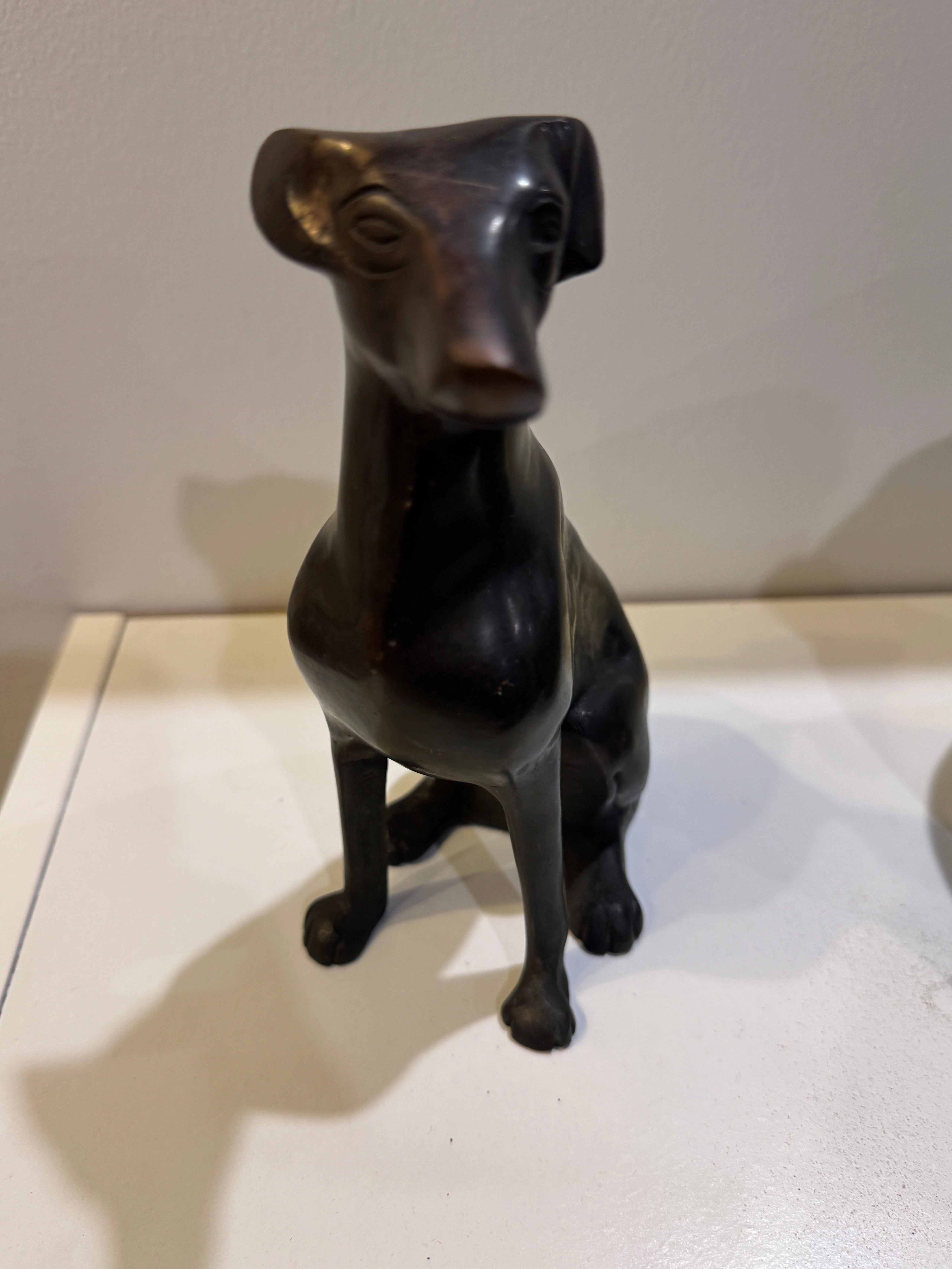 Metal Black Dog Sitting Up