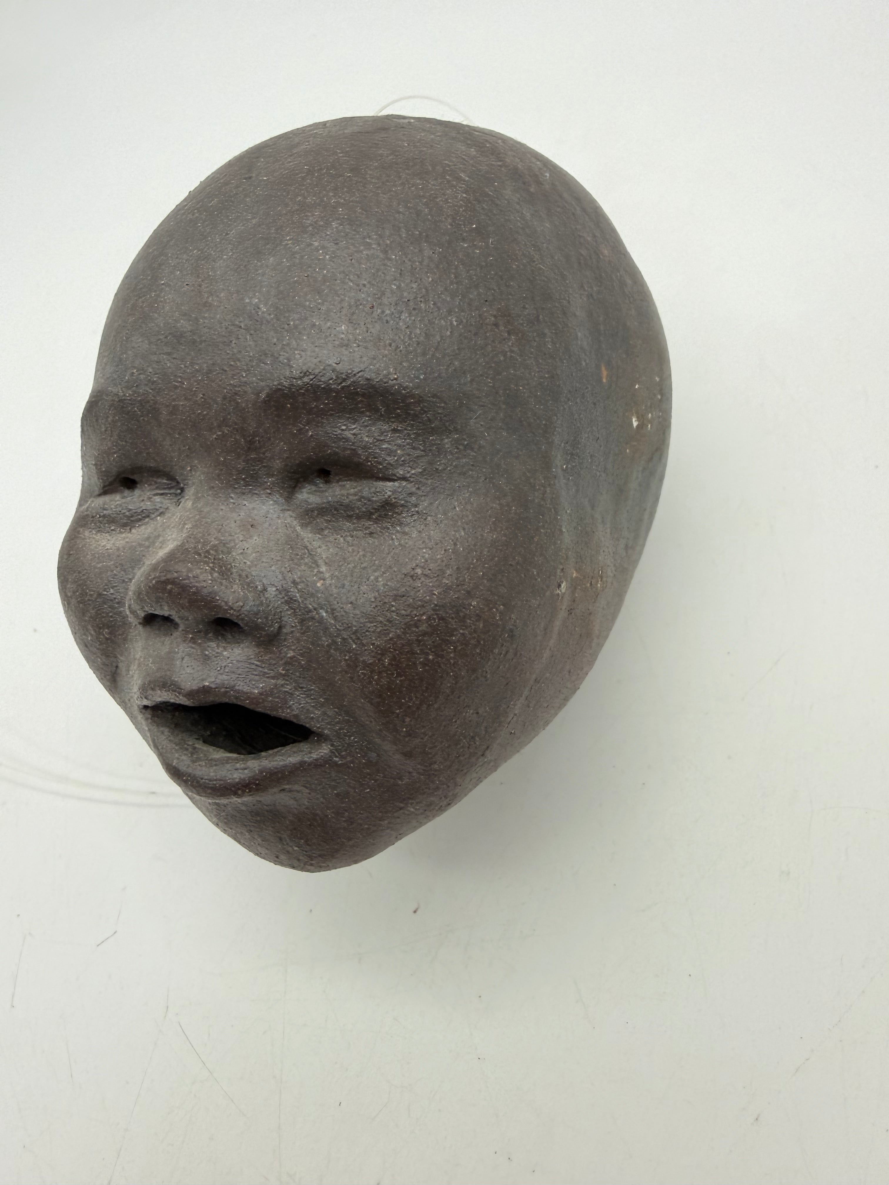 5” studio pottery hanging doll head dark brown