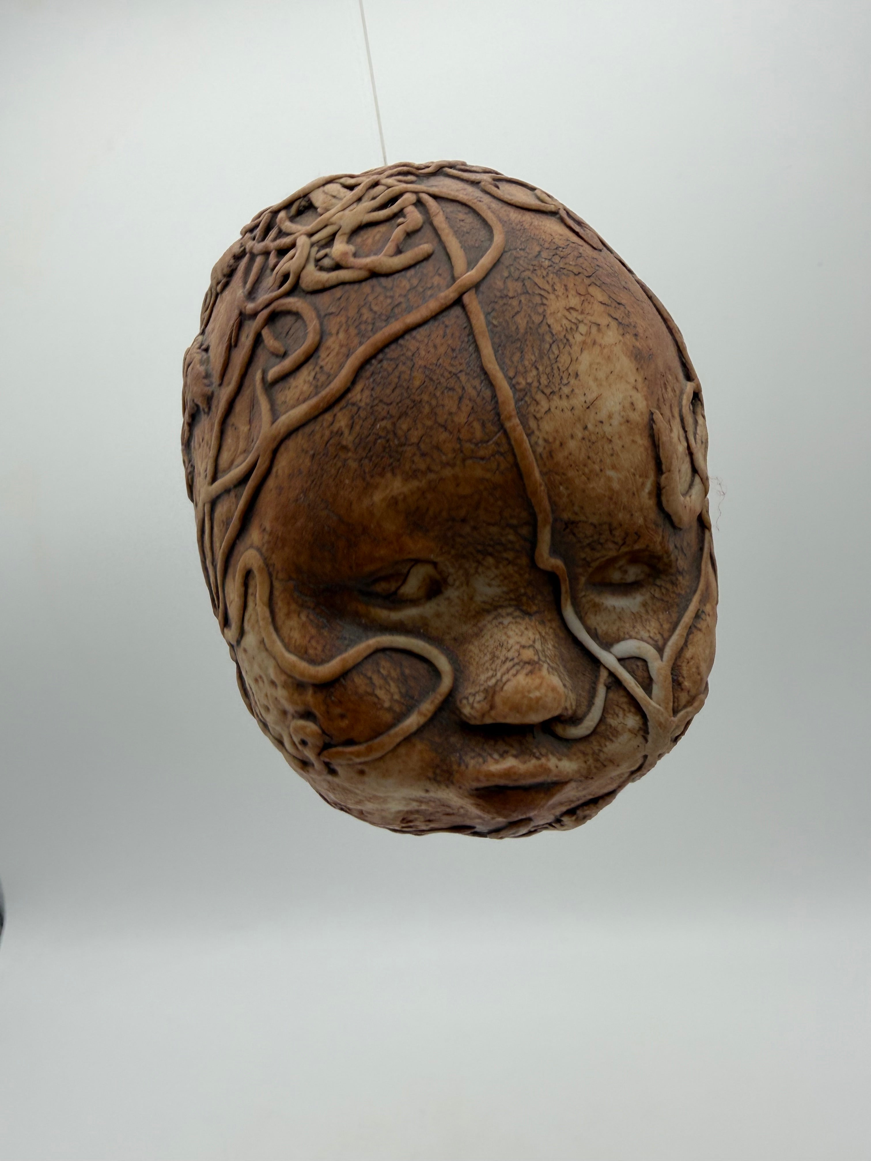 5” studio pottery doll head squiggle design hanging