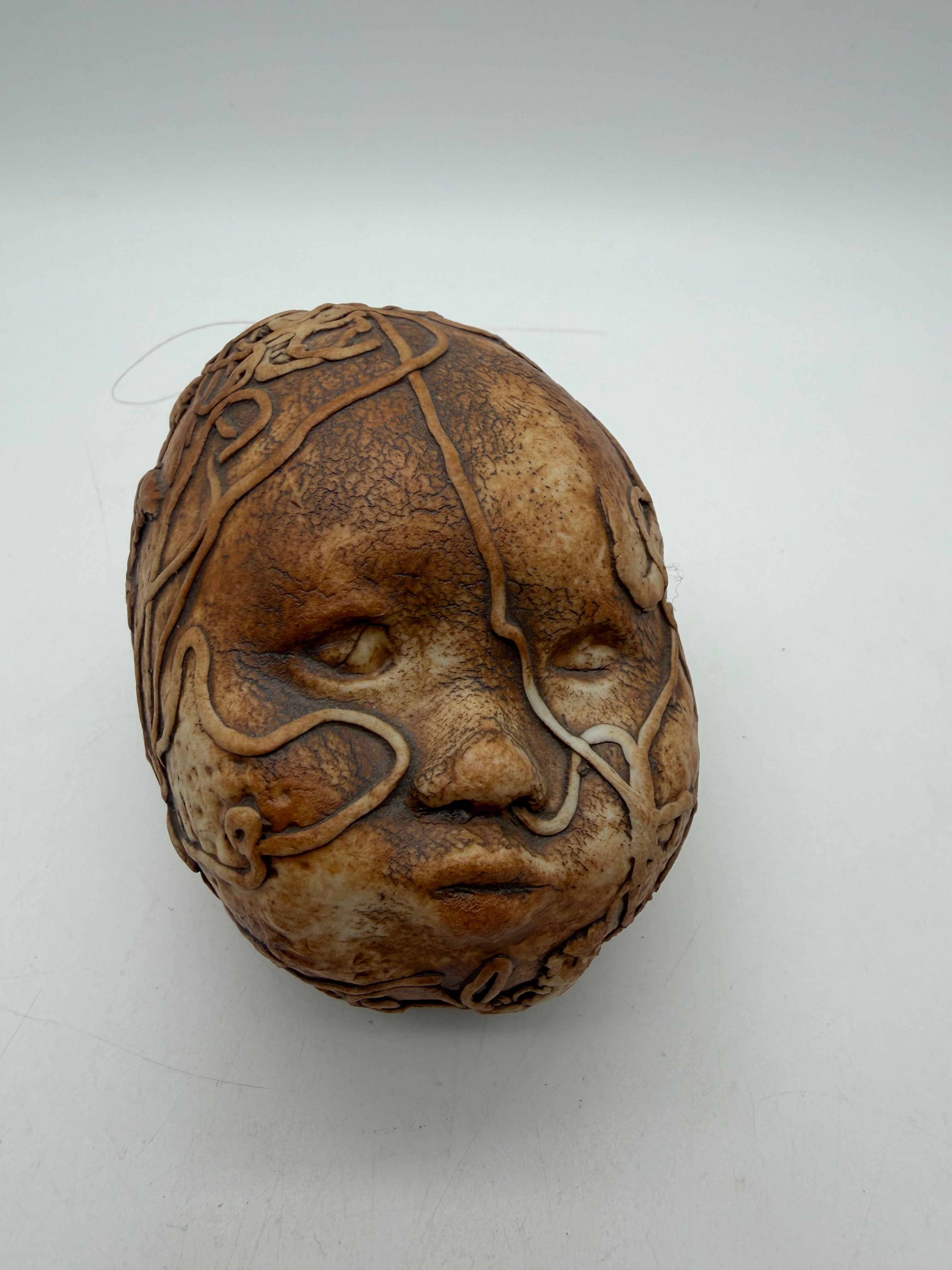 5” studio pottery doll head squiggle design hanging