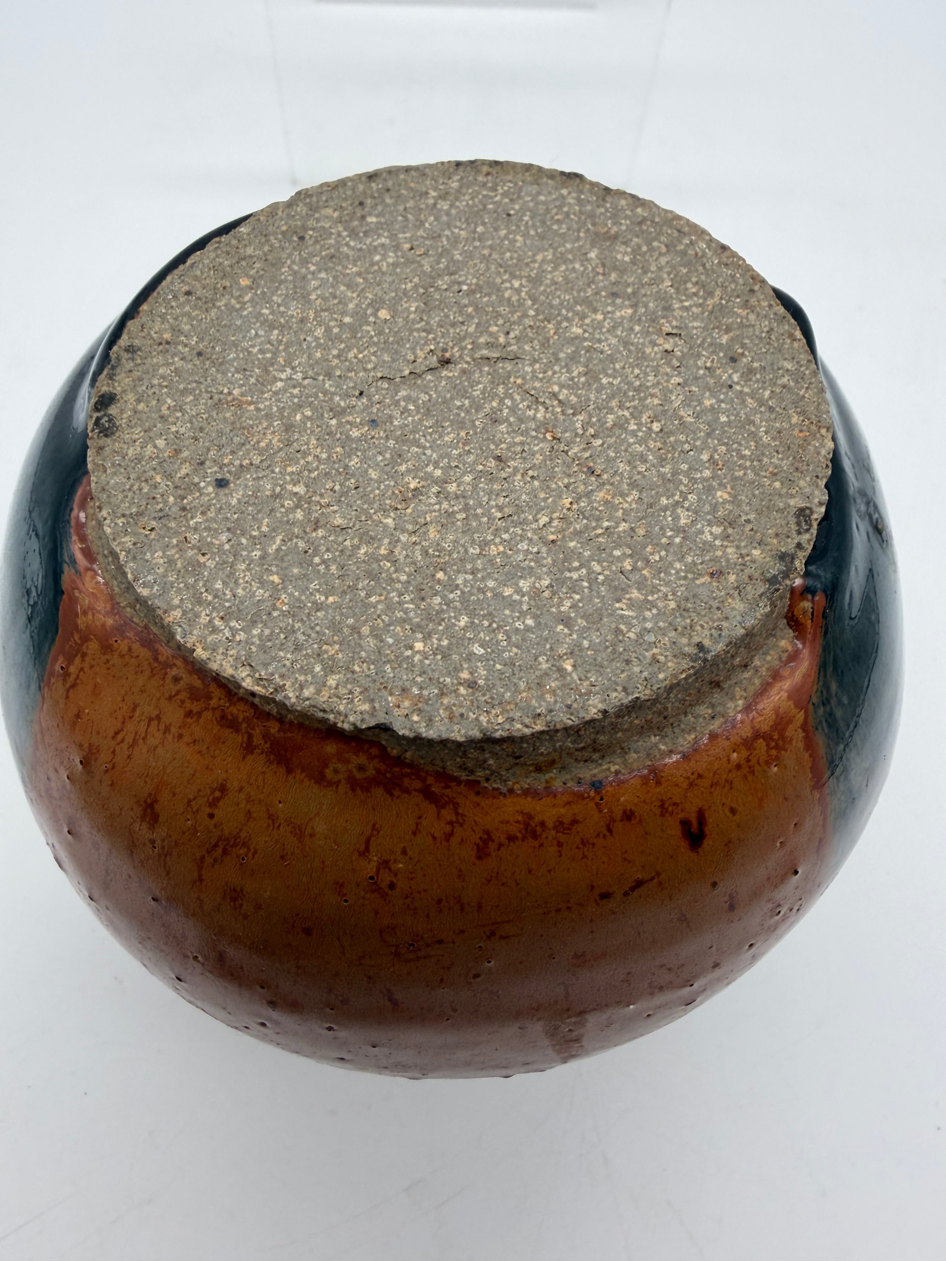 5” bulbous orange and black studio pottery vase
