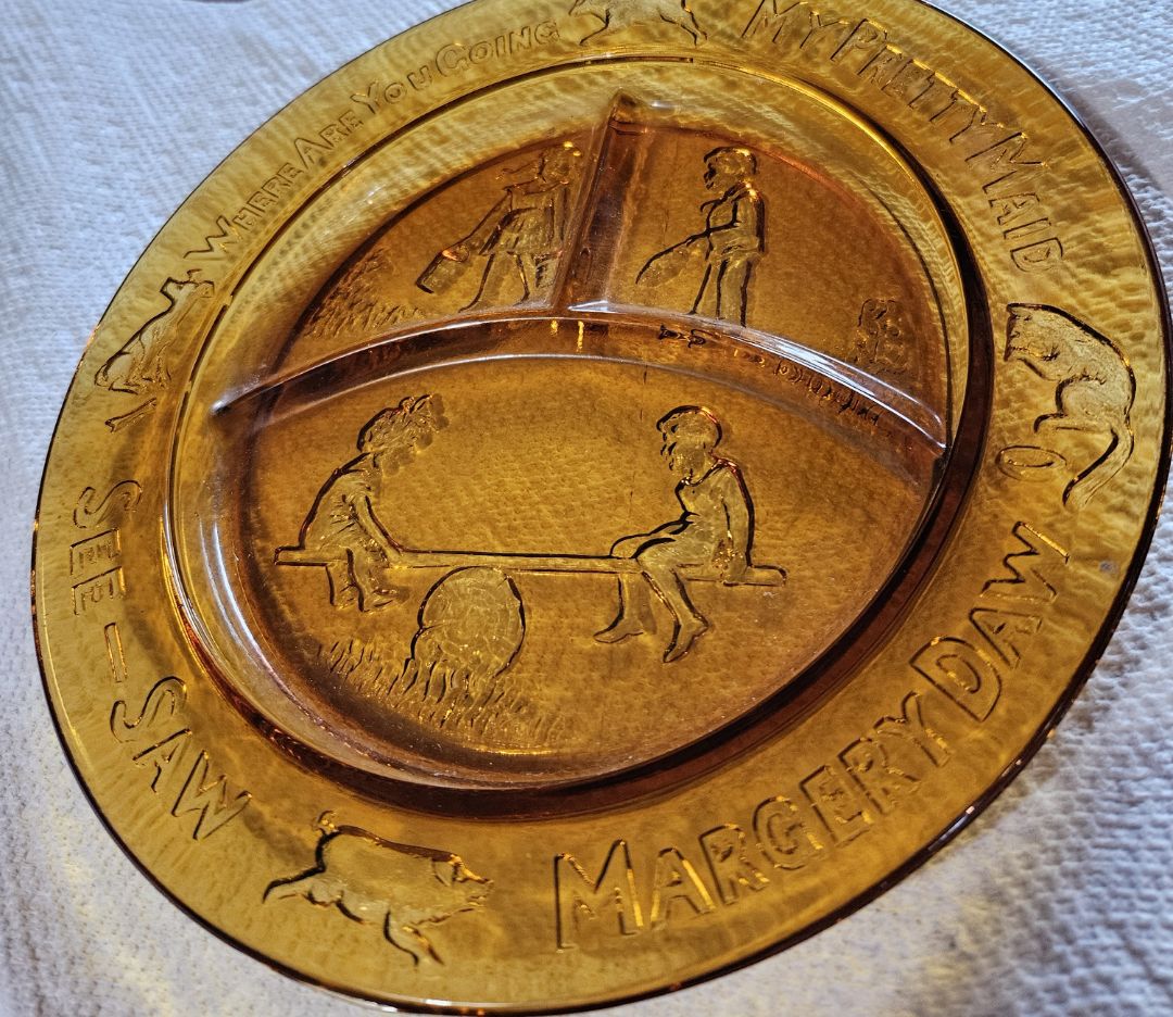 Vintage amber nursery rhyme plate embossed with See Saw Margery Daw