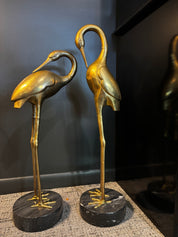 vintage brass crane sculpture with marble base