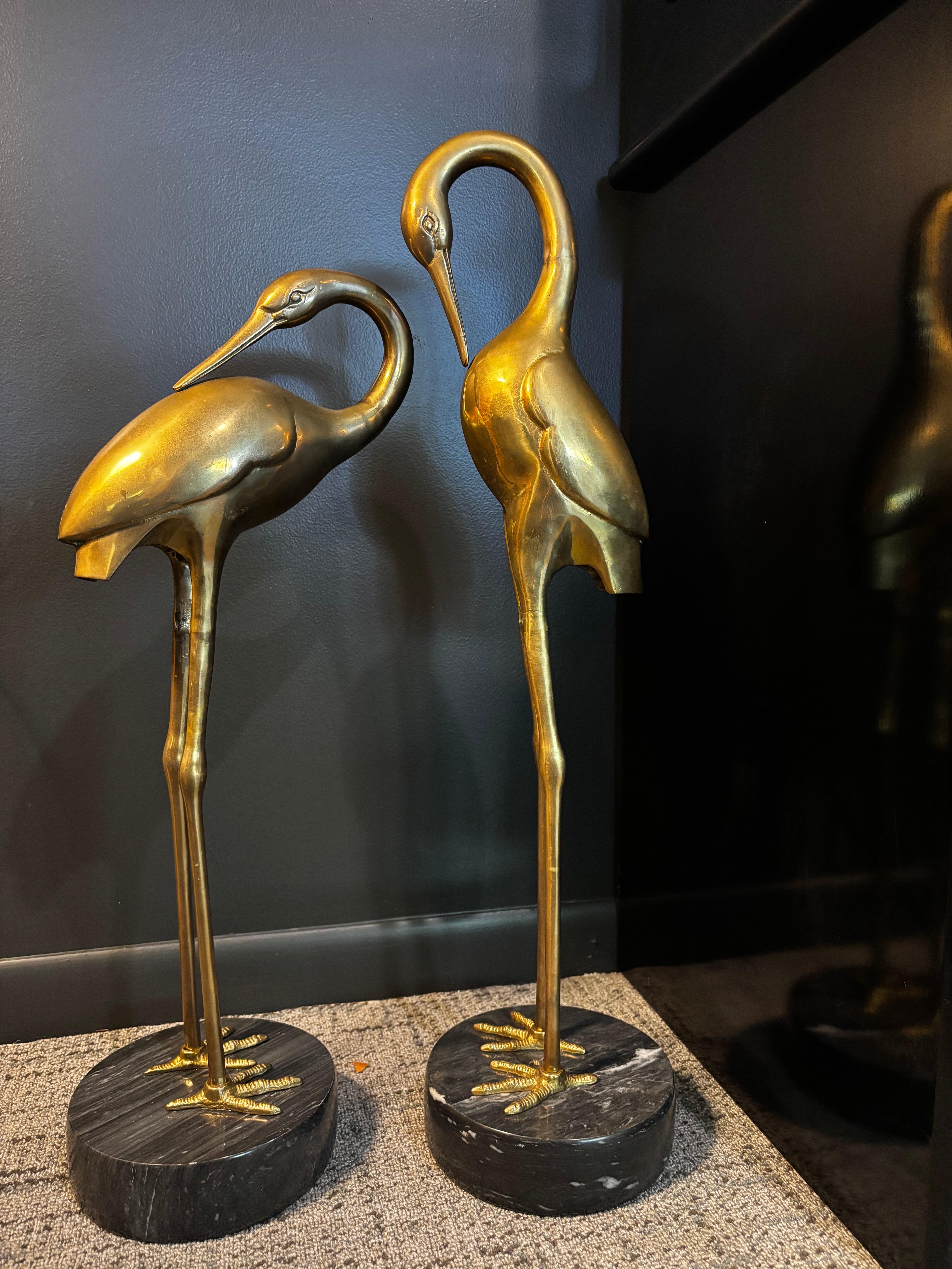 vintage brass crane sculpture with marble base