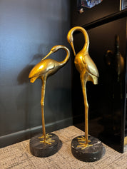 vintage brass crane sculpture with marble base