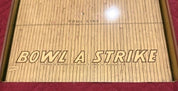 "Bowl A Strike" by T. Cohn