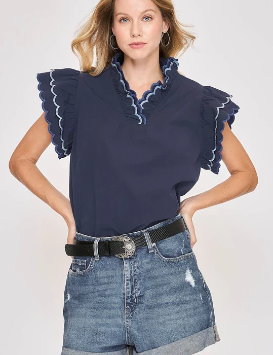 Navy cotton scallop trim ruffle sleeve top with relaxed fit and feminine detailing, styled for everyday wear – JSQ Mercantile – a women’s boutique and gift shop in La Grange, IL.