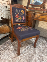 Antique Eastlake Blue floral needle point chair with front wheels