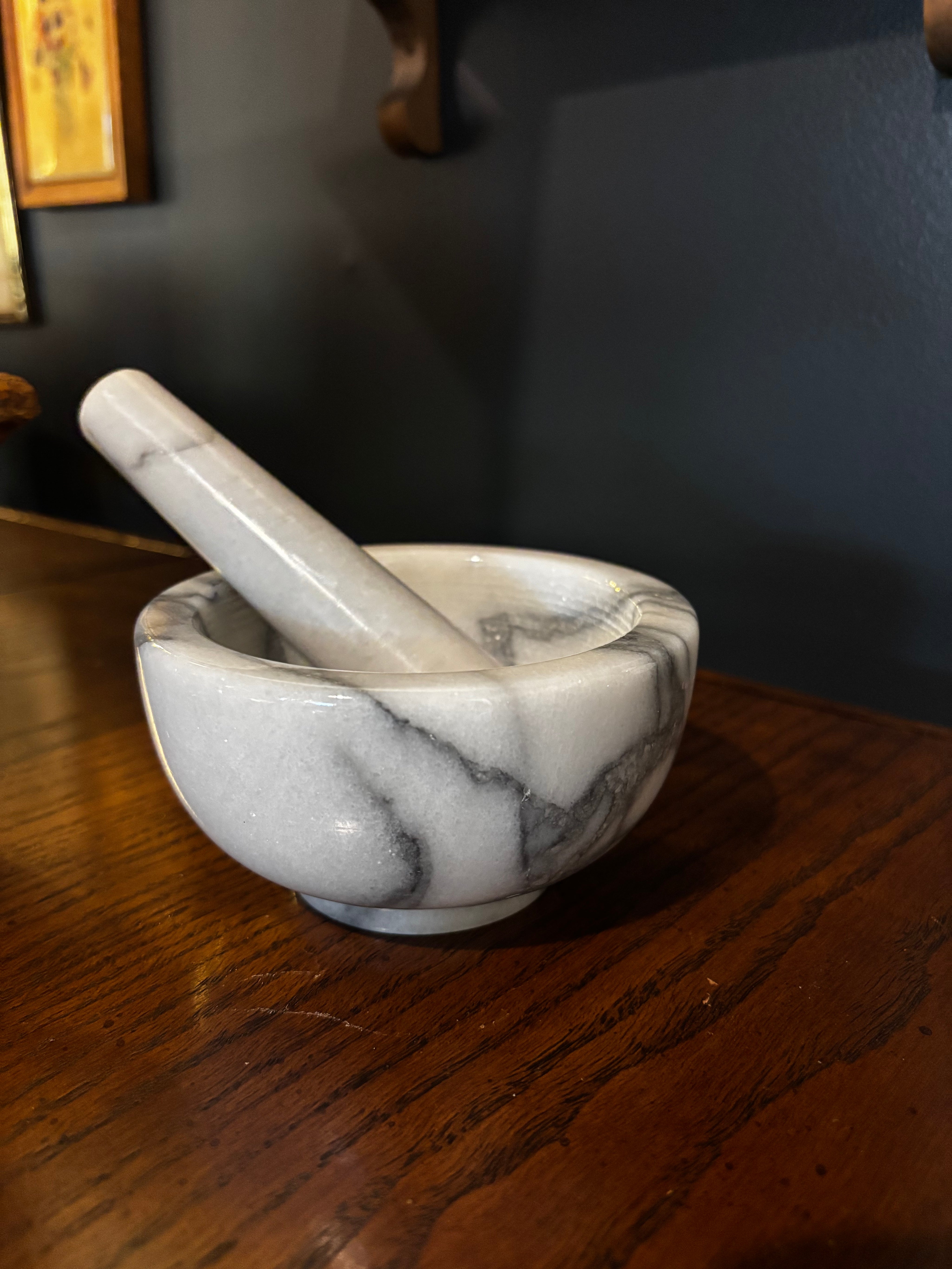 white marble mortar and pestle