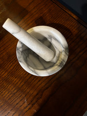 white marble mortar and pestle